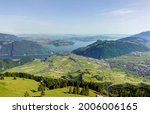 Magnificent panoramic aerial views of central Switzerland, mountains, villages and Lake Lucerne as you ascend the Cabrio cable car up Mount Stanserhorn in Switzerland. City of Stans.                  