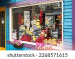Small photo of Stuffed figures of toys on display in gifts shop window. Minion models decorated at front of Minion Mart, a shop sale souvenirs from Minion animation film-Richmond BC Canada-January 23,2023