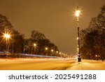 A Snow Covered Avenue With...