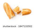 Top view of teared french baguette isolated on white background.
