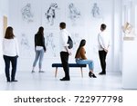 Visitors In Art Gallery With...