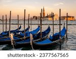 Small photo of The San Giorgio Maggiore Basilica on a small island in front of San Marco. Built in 1566 by Palladio. The Gondolas are parket waiting to the next wonderful trips in this magic city.