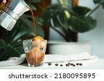 Small photo of homemade Affogato, Italian Moka coffee pot, affogato is dessert with coffee as base ingredient typically scooping a scoop of gelato or vanilla ice cream into a cup. Then pour one shot of hot espresso.