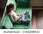 Relaxed Woman Using Laptop...