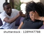 Small photo of Tired frustrated african wife ignoring angry black despot husband arguing blaming upset woman of problems, jealous man shouting at sad girlfriend, family fight and controlling boyfriend, disrespect