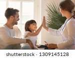 Healthy happy child girl giving high five to female caring doctor celebrate good checkup medical result recovery visiting pediatrist in hospital, pediatrician with kid patient good relationship trust