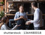 Small photo of Hostile angry restaurant client couple or friends talking with waiting staff in public place complains about cold coffee long service, spoiled tasteless dish waitress feels guilty mixed orders concept