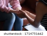 Close up of female doctor hold woman patient hands help on personal therapy session, psychologist or counselor show understanding and care, support depressed suffering client on treatment