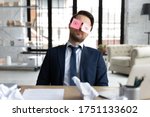 Exhausted male employee sit at desk with stickers on eyes fall asleep nap at workplace, tired businessman or boss sleeping in office, overwhelmed with work, feel fatigue exhaustion, overwork concept