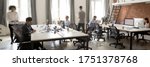 Small photo of Group of multi ethnic corporate employees working in co-working open space walking in motion, sit at shared desks. Busy workday, office rush concept. Horizontal photo banner for website header design
