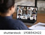 Small photo of Over shoulder view of female worker have webcam digital virtual conference with diverse multiethnic colleagues. Woman speak talk on video call with multiracial businesspeople. Online meeting concept.