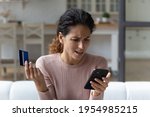 Small photo of Access denied. Angry hispanic woman unable to make payment via smartphone scold mobile banking service for error mistake. Annoyed young lady ebank client enter wrong password from personal credit card