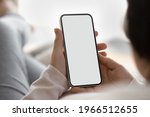 Crop close up back view of young pregnant Caucasian woman hold use modern smartphone browse wireless internet. Wife look at white empty mockup screen on cellphone talk on video virtual call.