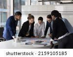 Small photo of Multi racial company management, staff members cooperate together gather in boardroom at briefing, discuss business ideas, search solution, review sales results engaged in teamwork, brainstorm concept