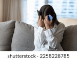 Small photo of Desperate frustrated bank client woman facing scam, overspending, problems with online payments, blocked credit card, bankruptcy, holding smartphone, touching head, covering face