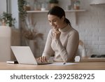 Small photo of Smiling pretty woman searching information on internet, working or studying, busy in self-education, ordering goods or food on-line using laptop. E-commerce client, modern wireless tech usage concept