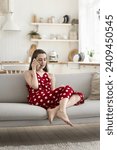 Small photo of Girl blab on cellphone sit on sofa at home, lead informal conversation to boyfriend, share news, speaks to parents, speaks to friend planning weekend activities. Communication, mobile connection, talk