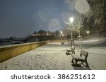 Night scenery of snowy Prague streets with bokeh