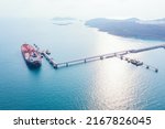 Small photo of Aerial top view pipeline transport. natural gas pipeline for oil delivery ships. Oil tanker ship to Port of Europe - import export, Oil tanker ship of business logistic sea going ship