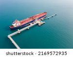 Small photo of Aerial view of Modern sea harbor with transhipment equipment for oil tankers. Deck of crude oil tanker with cargo pipeline. Oil tanker ship to Port of Europe - import export