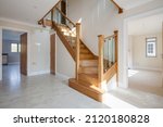 Small photo of Great Wilbraham, Cambridgeshire, England - March 27 2017: Entrance hall within brand new unfurnished home with stairs leading to first floor