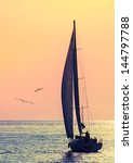 Yacht Sailing Against Sunset....