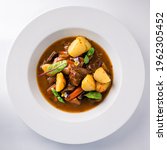 Small photo of beef stew with potatoes, Irish Stew or Guinness Stew made in a crockpot or slow cooker, delicious stew estofado with beef and vegetables top view, flat lay on a white background