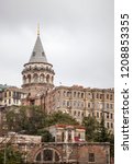 Small photo of Galata Tower, land view. Galata tower The pre-Byzantine Galatians went up to their people and the watch tower of the Golden Horn was later used as a fire observation tower. Istanbul, Turkey, in 2018.