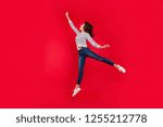 Small photo of Full length size body photo of fly high with magical invisible bumbershoot holding it by one hand attractive she her girl wearing white casual sweater on red vivid bright background
