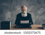 Small photo of Portrait of his he nice attractive content peaceful focused top executive director professional publisher occupation typing letter news over concrete wall background