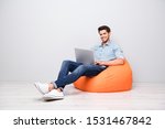 Small photo of Turned full length body size photo of cheerful toothy handsome attractive man smiling beaming enjoying finishing his project isolated over grey color background