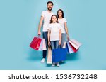 Full length photo of three people mom mommy dad daddy schoolkid shop retail on black friday wear white t-shirt denim jeans sneakers isolated over blue color background