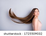 Profile photo of attractive model lady look demonstrate ideal neat long healthy hairstyle flying on air after lamination procedure wear beige singlet isolated grey color background