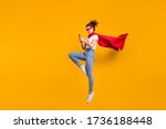 Full length body size view of her she nice attractive lovely cheerful focused girl jumping wearing cape using digital device 5g app isolated on bright vivid shine vibrant yellow color background