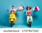 Small photo of Full size photo positive two people man woman driver rider biker ride scooter motor bike shopping center buy bags enjoy off-sales wear red dotted dress shirt isolated blue color background