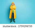 Small photo of Full length body size view of his he nice serious sad grey-haired man fisherman wearing long yellow topcoat folded arms bad weather isolated on bright vivid shine vibrant blue color background