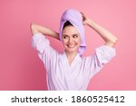 Close-up portrait of nice attractive cheerful girl wearing turban on head washing hair isolated over pink pastel color background