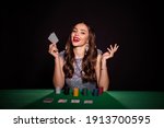 Small photo of Photo of lady sit poker table hold two cards call bet cheerful smirk wear glossy dress isolated black color background
