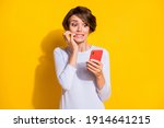 Small photo of Photo of worried troubled lady hold telephone gnaw nails wear white shirt isolated yellow color background