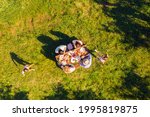 High above angle view big full family having picnic outside cheerful on holidays children playing running around