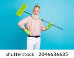 Photo of aged man happy positive smile king hold cleaning mop dust wash household isolated over blue color background