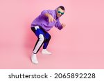 Small photo of Full length photo of funky young brunet guy dance wear eyewear hoodie pants shoes isolated on pink background