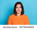 Small photo of Portrait of attractive unsure uncertain girl biting lip waiting expecting bad news oops isolated over bright blue color background