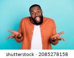 Photo of young afro man happy positive smile ask questioned puzzled isolated over teal color background