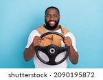 Small photo of Photo of cheerful auto rider hold steering wheel wear white t-shirt jumper front-tie isolated blue color background