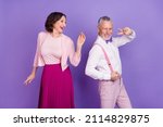 Small photo of Portrait of two excited funky people enjoy discotheque event isolated on violet color background