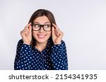 Small photo of Portrait of attractive funny curious cheerful girl looking aside copy space guess isolated over grey pastel color background