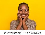Photo of shiny excited lady dressed checkered shirt arms cheeks smiling isolated yellow color background