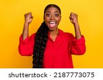 Small photo of Photo of young excited girl rejoice luck ecstatic lottery fists hands triumph isolated over yellow color background