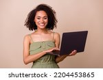 Small photo of Photo of gorgeous lovely cheerful freelancer wavy hairstyle khaki overall hold notebook remount job isolated on beige color background